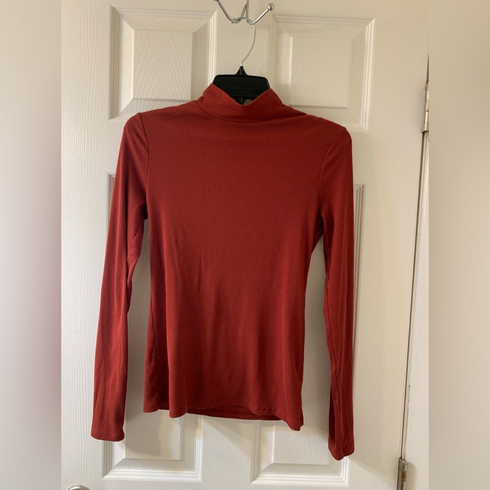 Woman’s burnt orange mock top long sleeve shirt